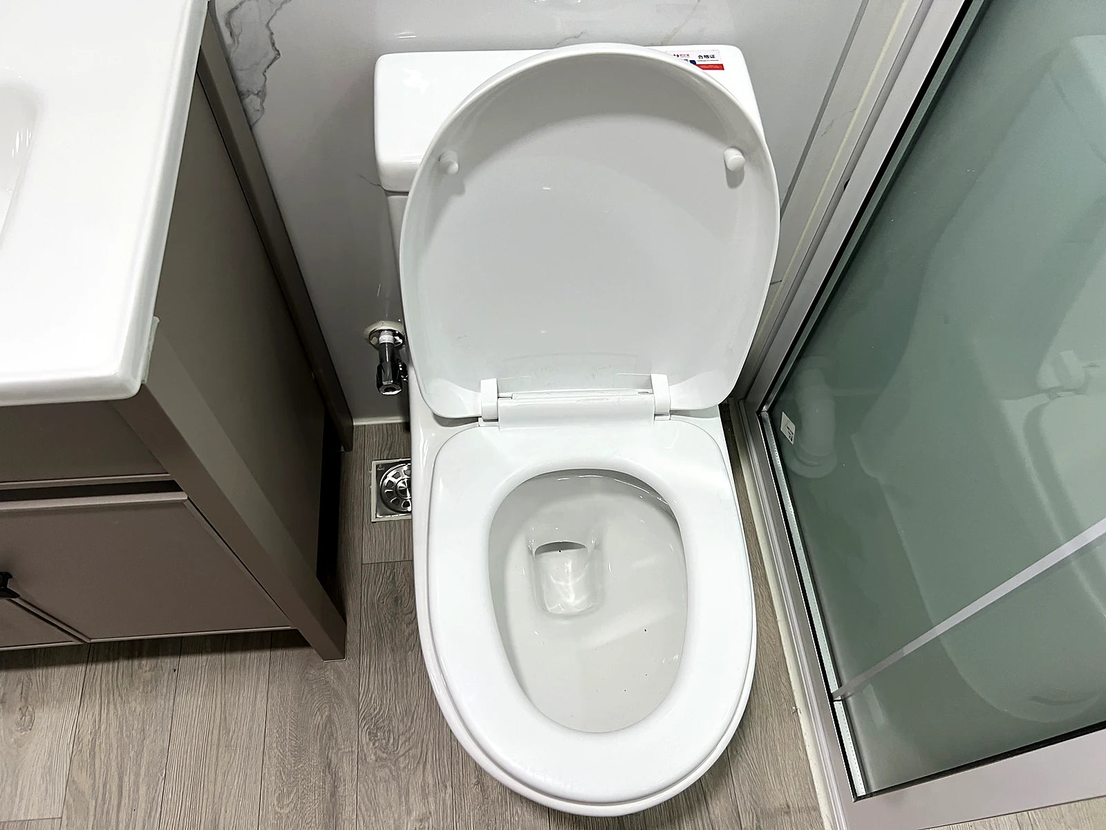 Toilet beside bathroom vanity